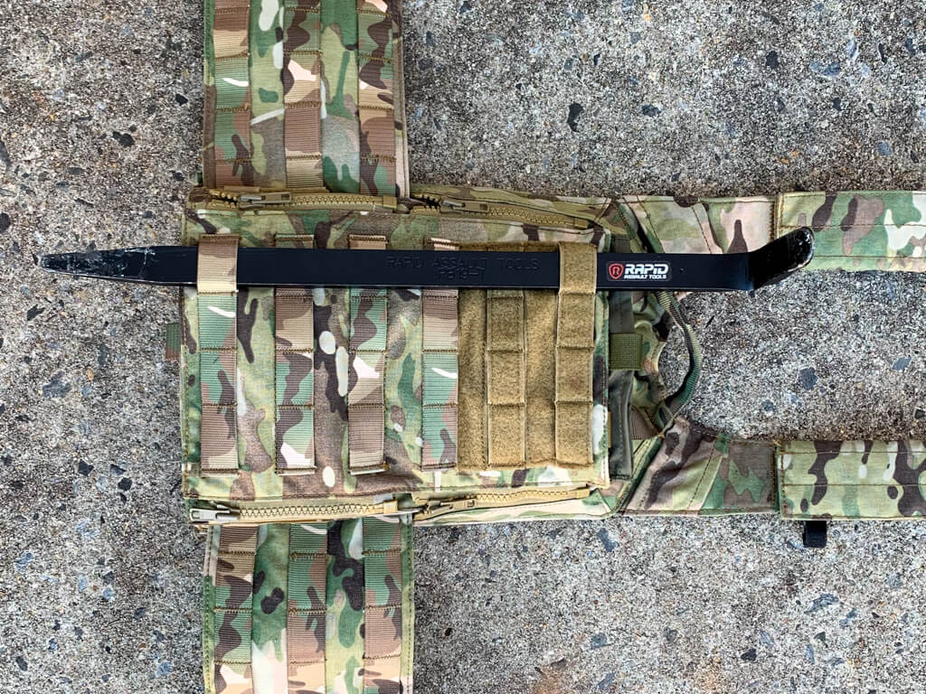 A piece of camouflage fabric with a belt and some other things