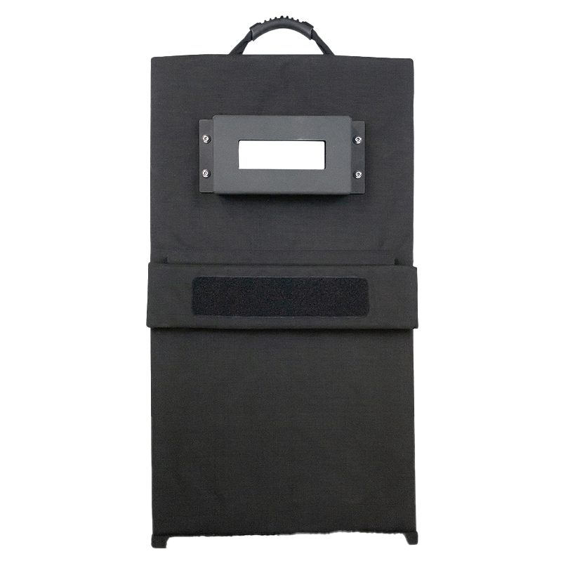 A black bag with a handle and a tag on the front.