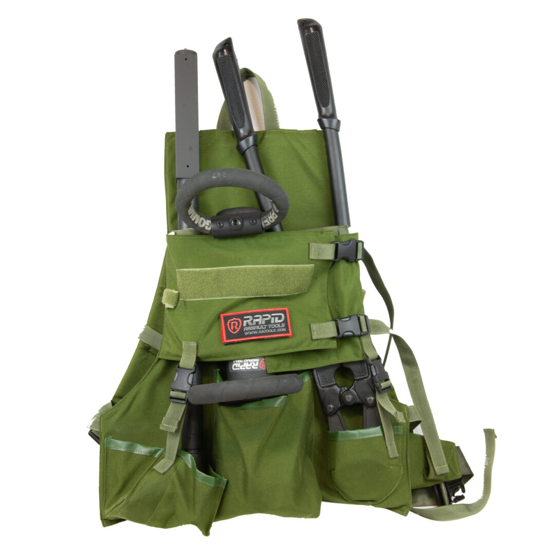 A green tool apron with tools on it.