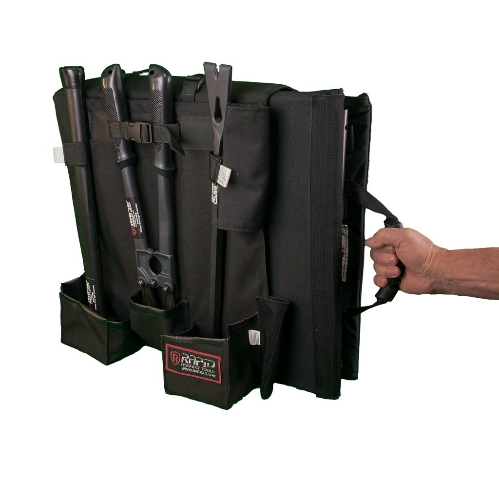 A hand holding an open bag of knives.