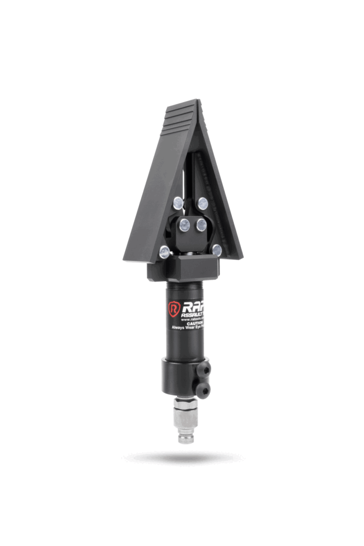 A black arrow shaped device with a red dot on it.