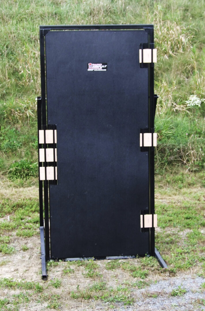 A black box with two gold bars on top of it.