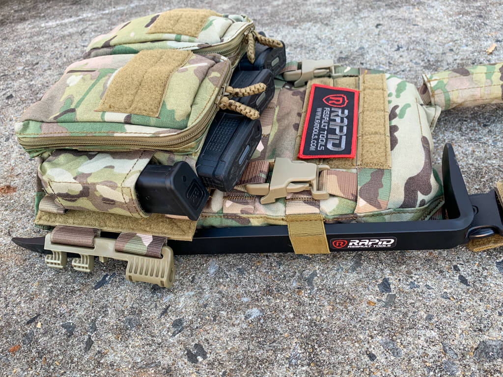 A backpack that is laying on the ground.