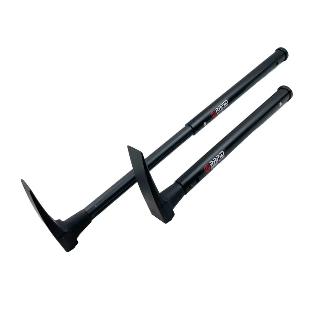 A pair of black metal handles with red lettering.